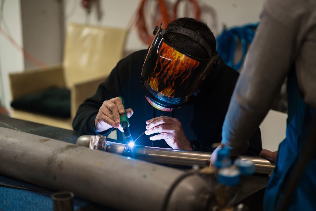 man-working-with-argon-welding-machine-garage (2)